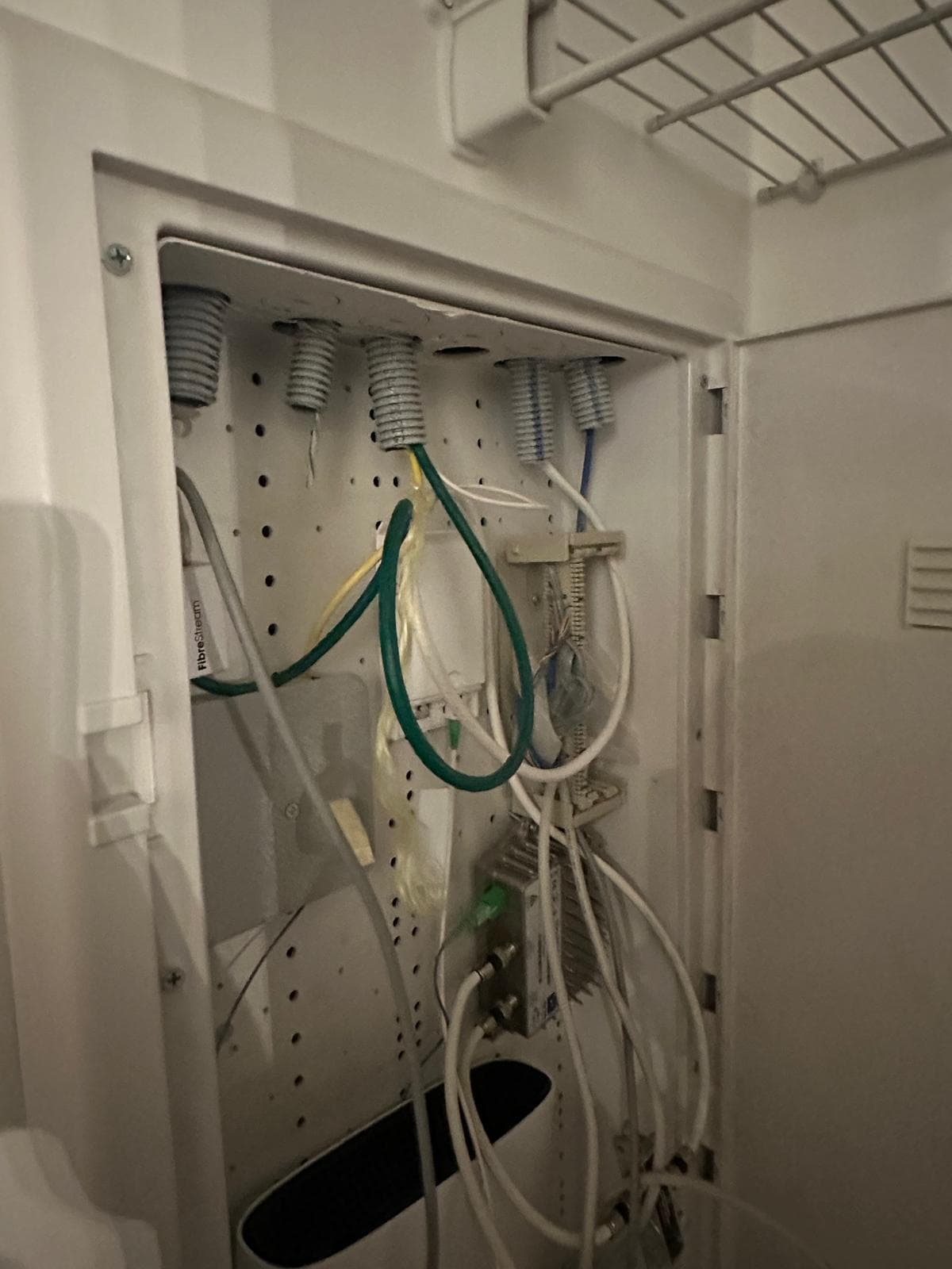 Structured media enclosure with fiber, coax, and network panel